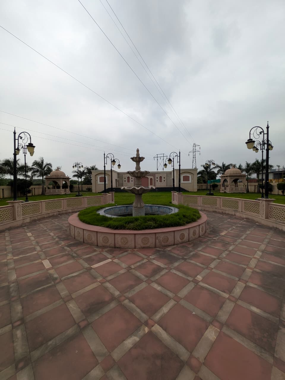 Tiered fountain and tiled courtyard at The Royal Courtyard banquet venue in Chandrapur