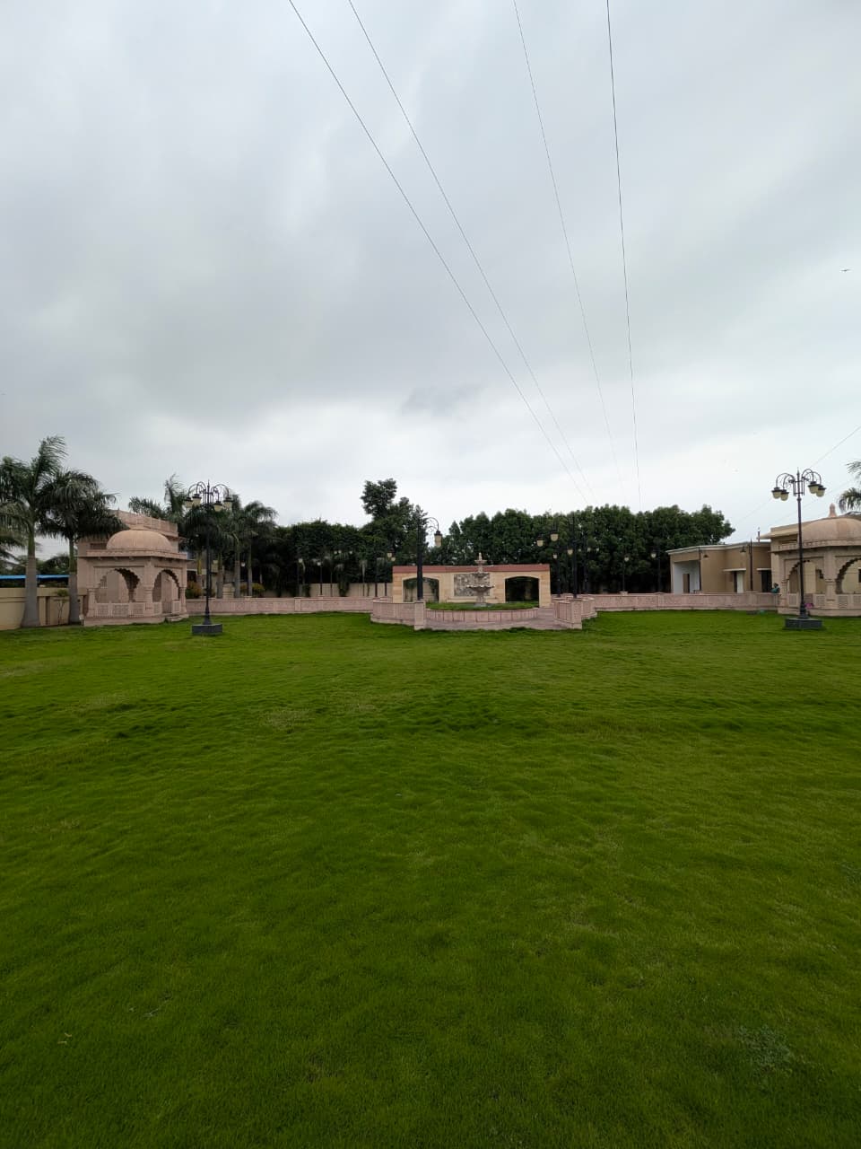 Wide open green lawn for wedding functions at The Royal Courtyard, Lakhamapur Chandrapur