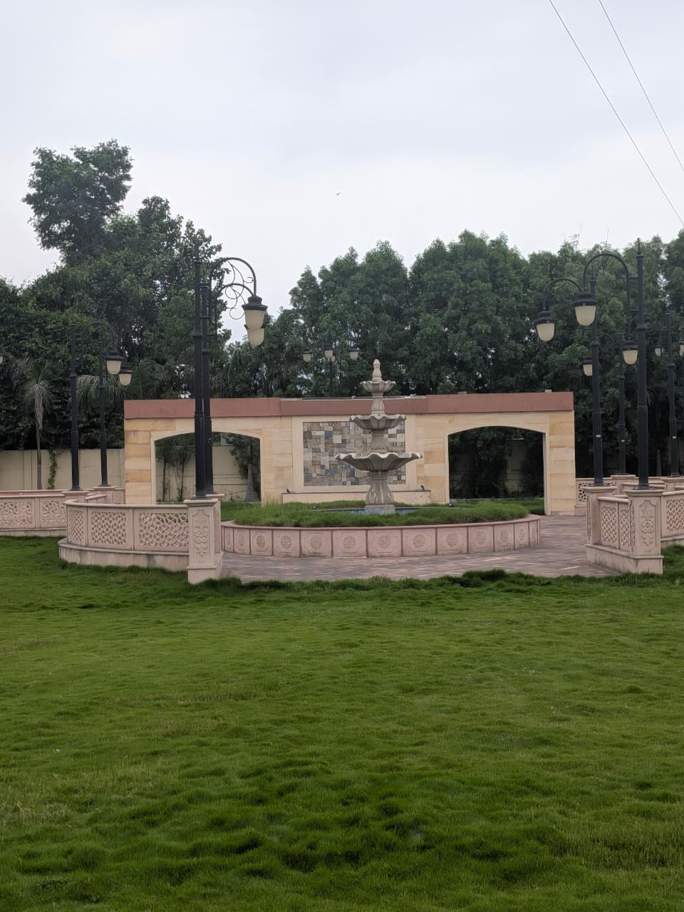 Fountain courtyard and manicured lawn at The Royal Courtyard wedding venue in Chandrapur